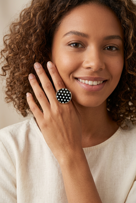 A light-skinned 20-year-old African American model wearing the Retro Polka Dot Ring