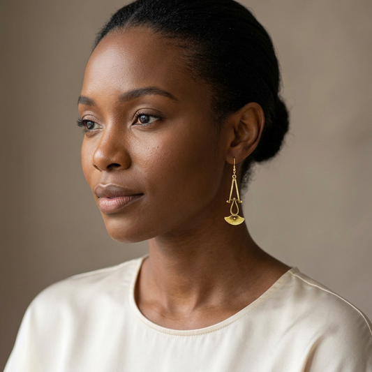 Woman wearing a small version of the bronze earrings