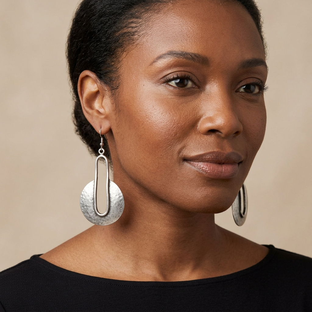 Woman wearing the handmade pewter earrings