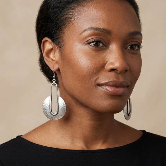 Woman wearing the handmade pewter earrings